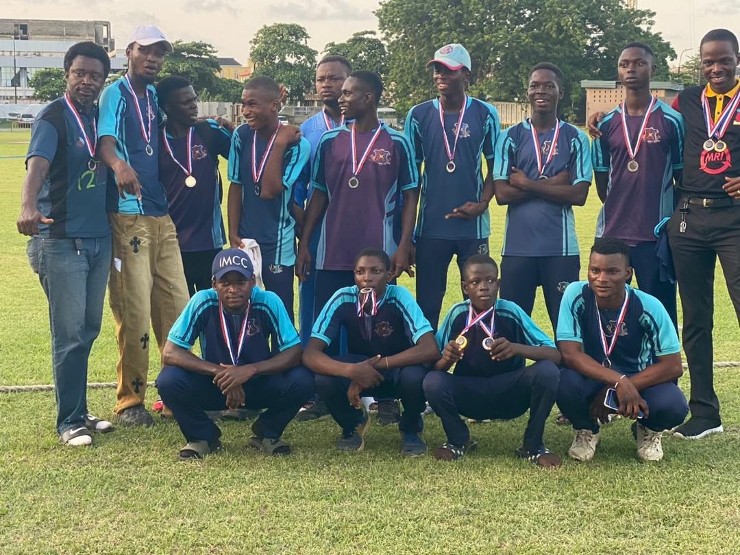 The squad grouped together wearing their medals